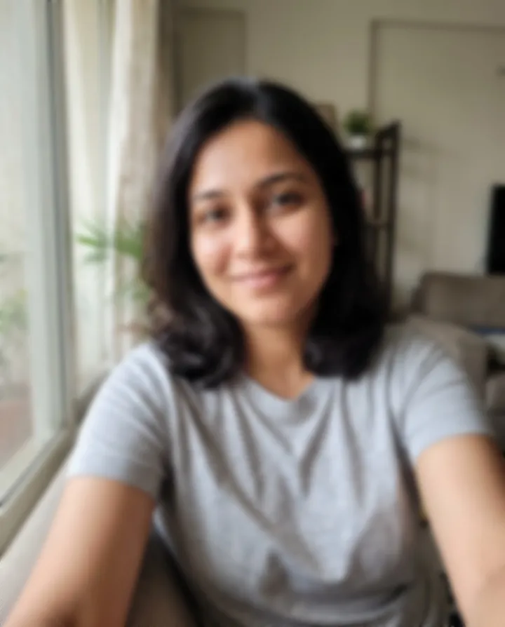 A blurry selfie of a woman by a window (an AI-generated person)